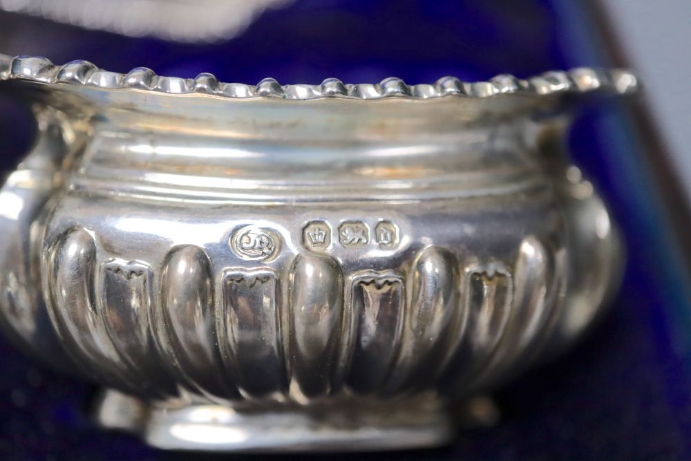 A late Victorian cased silver seven piece condiments set and five spoons (one associated), John Round, Sheffield, 1896.